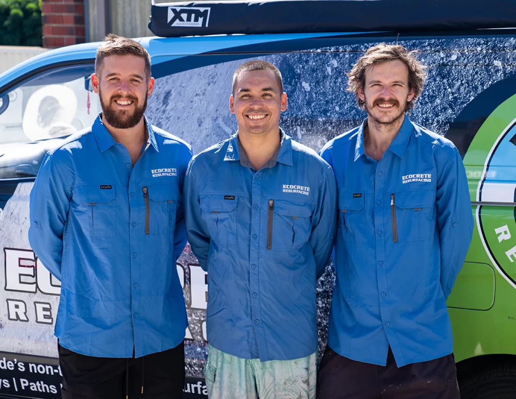Ecocrete Resurfacing Adelaide​ team in blue uniforms by a company vehicle.